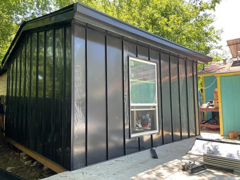 Black standing seam metal wall panels for Roof Inspection in Belle Haven