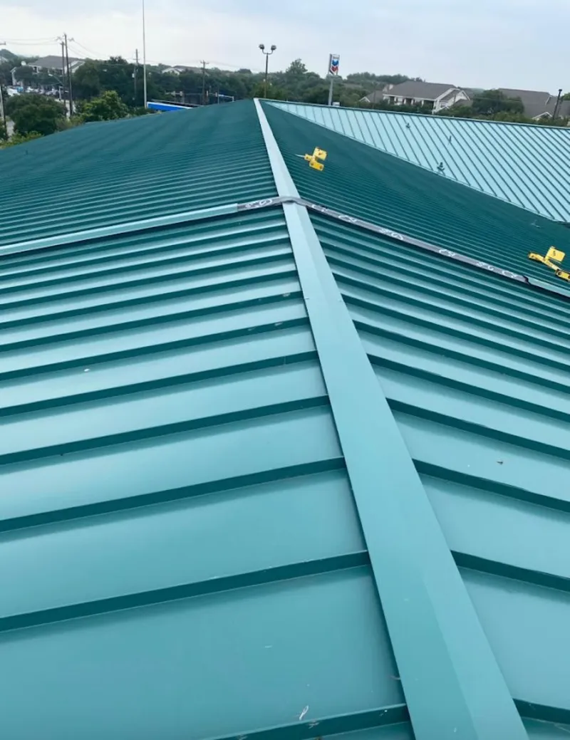 Green commercial metal roof ridge and valley for Metal Roof Repair in Belle Haven