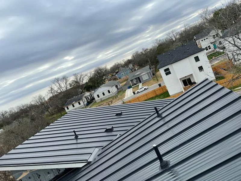 Standing seam metal roof panels with vents for Skylight Repair in Belle Haven